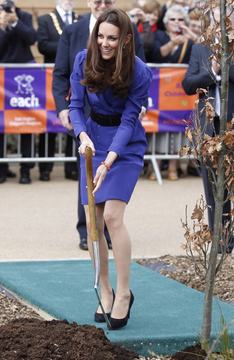 Image: Britain's Catherine, Duchess of Cambridge plants a tree after opening a children's hospice in Ipswich